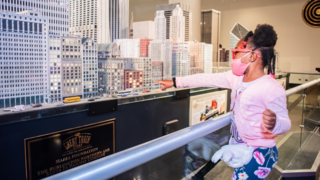 A child points at the Great Train Story exhibit