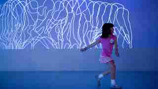 Girl dancing in Get in the Action exhibit