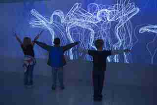 Young children dancing in Get in the Action exhibit